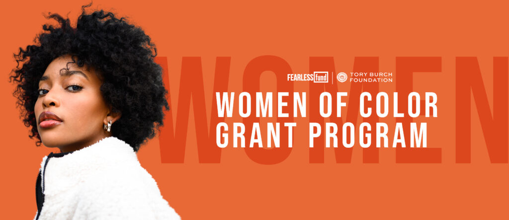 Women of Color Grant Program in partnership with the Fearless Fund. Black woman with Afro against orange background. 
